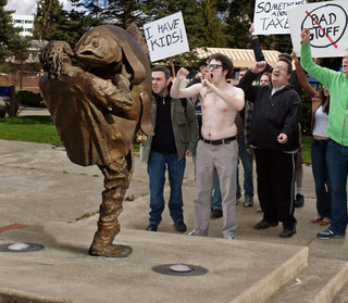 The morons demand a drawdown of troops in Iraq in front of what they believe to be a monument to fallen soldiers.